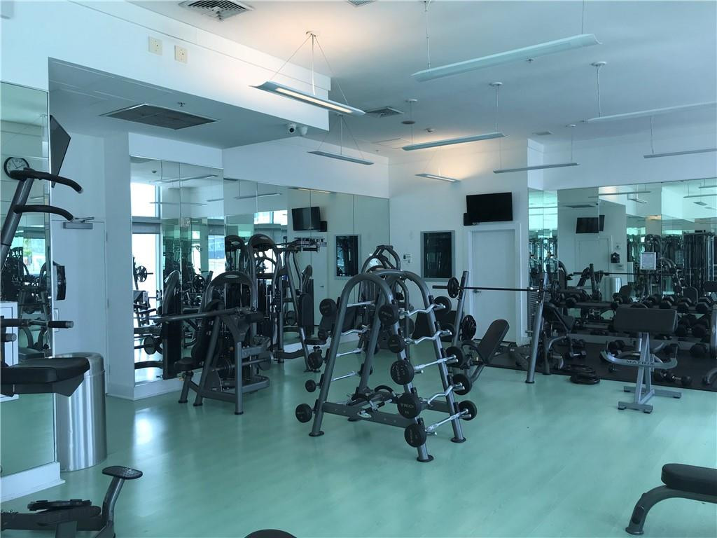 90 Southwest 3rd Street, Unit 1802 Miami, FL 33130 - Photo 38 of 50 a view of a room with gym equipment