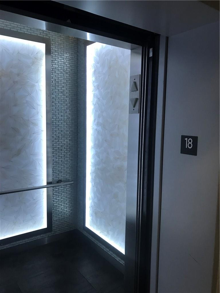 90 Southwest 3rd Street, Unit 1802 Miami, FL 33130 - Photo 48 of 50 a view of empty room with wooden floor and windows