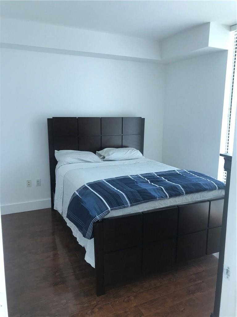 90 Southwest 3rd Street, Unit 1802 Miami, FL 33130 - Photo 6 of 50 a bedroom with a bed and window