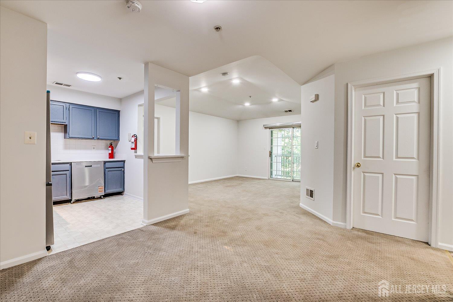 936 Waterford Drive Edison, NJ 08817 - Photo 14 of 29 a view of a kitchen with a sink and dishwasher a refrigerator with wooden floor