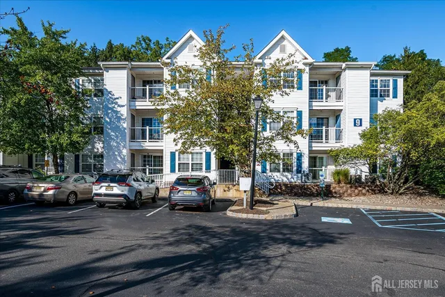 a city street lined with buildings and cars