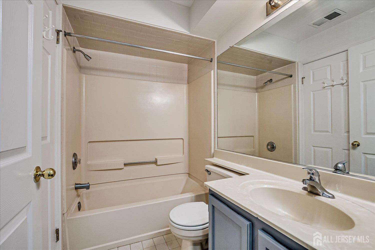 936 Waterford Drive Edison, NJ 08817 - Photo 25 of 29 a bathroom with a sink toilet and shower