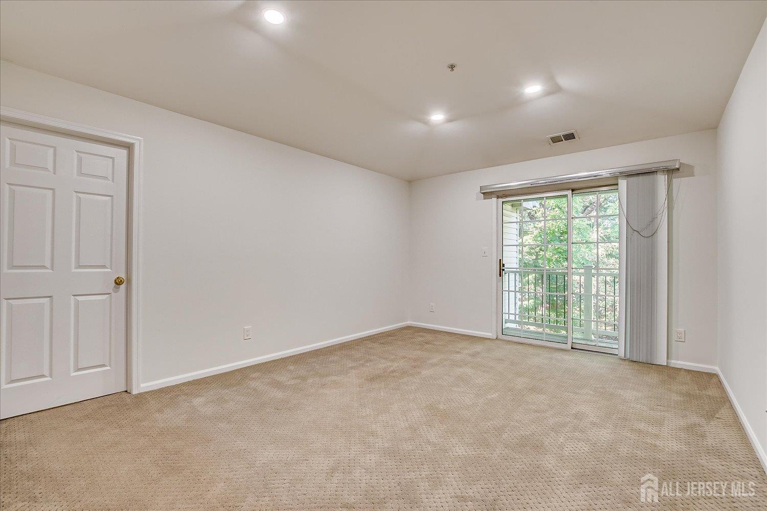 936 Waterford Drive Edison, NJ 08817 - Photo 9 of 29 a view of an empty room with a window