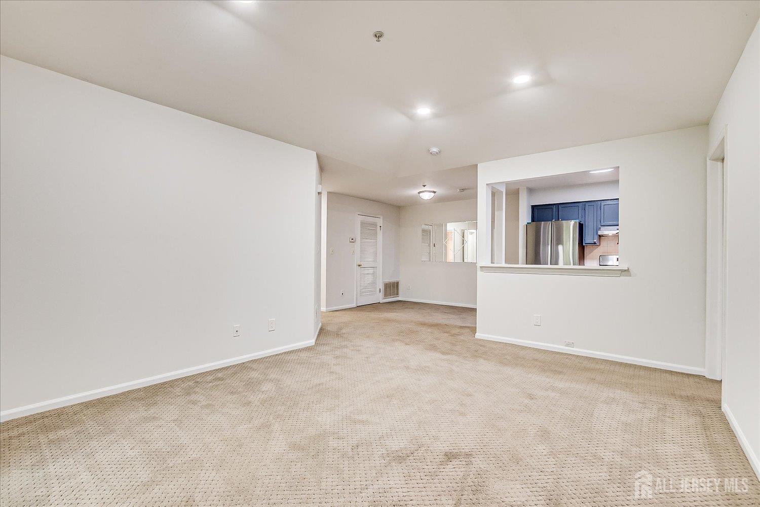 936 Waterford Drive Edison, NJ 08817 - Photo 10 of 29 an empty room with a kitchen and a sink