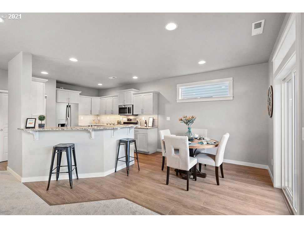 748 South 53rd Street Springfield, OR 97478 - Photo 6 of 13 a dining room with furniture and a wooden floor