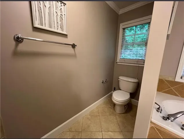 a bathroom with a toilet and a sink