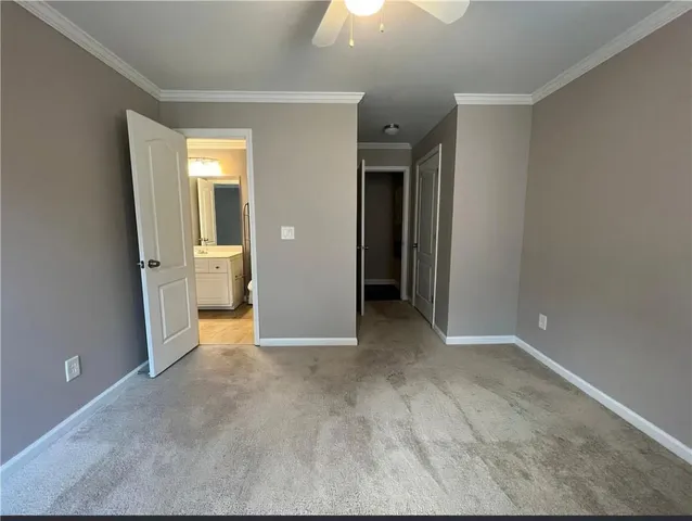 an empty room with windows and entrance