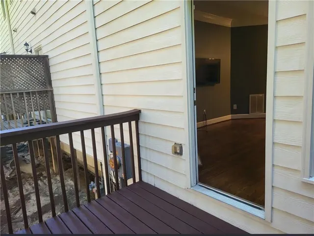 a view of balcony with wooden floor