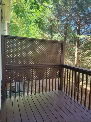a view of balcony with wooden floor