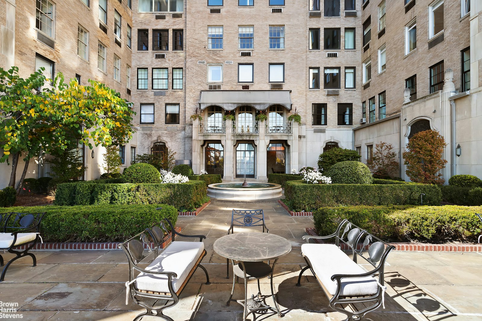 435 East 52nd Street, Unit 4A Manhattan, NY 10022 - Photo 4 of 13 a view of a building with garden and sitting area