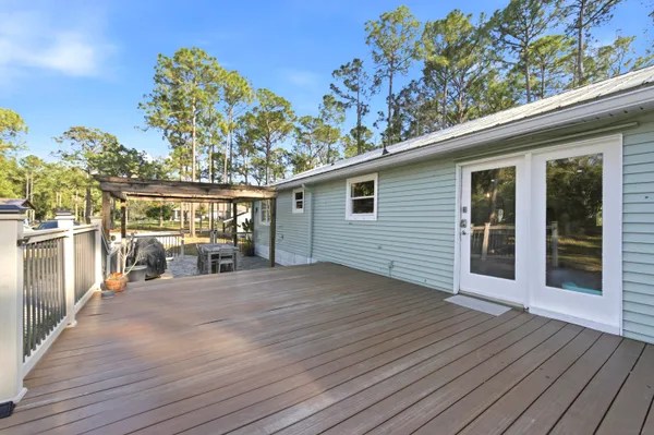 a view of porch with wooden floor