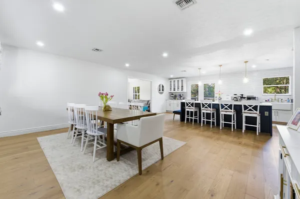 a kitchen with cabinets a sink dishwasher a stove and a refrigerator