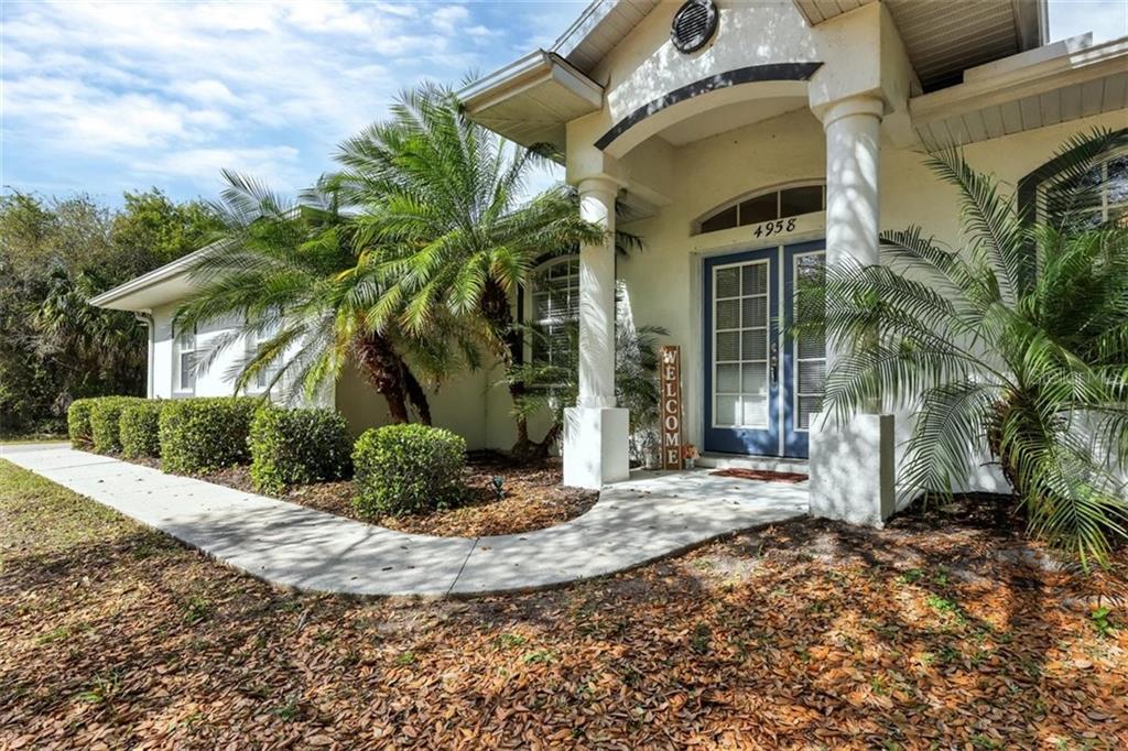 4958 Cummings Road North Port, FL 34288 - Photo 1 of 1 a view of a house with backyard and sitting area