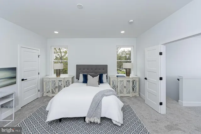 a bathroom with a sink toilet and mirror