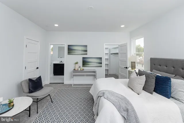 a bed room with a bed and a window