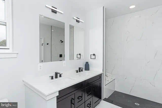 a bedroom with a bed and a lamp