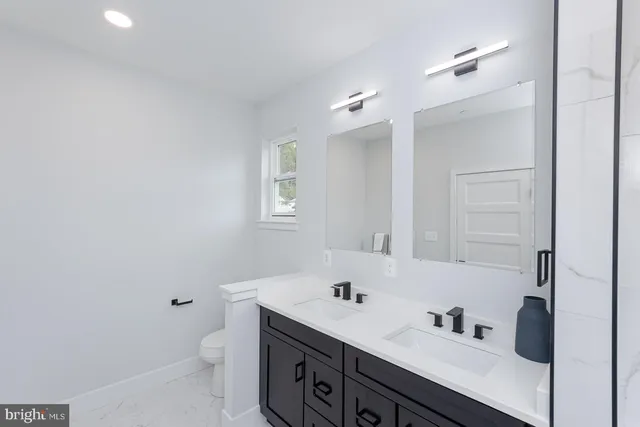 a view of a room with wooden floor and outdoor seating