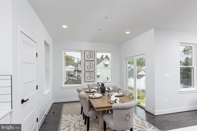 a living room with furniture wooden floor and a fireplace