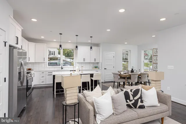 a living room with furniture potted plant and a fireplace