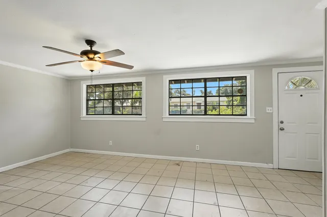 a view of an empty room with a window