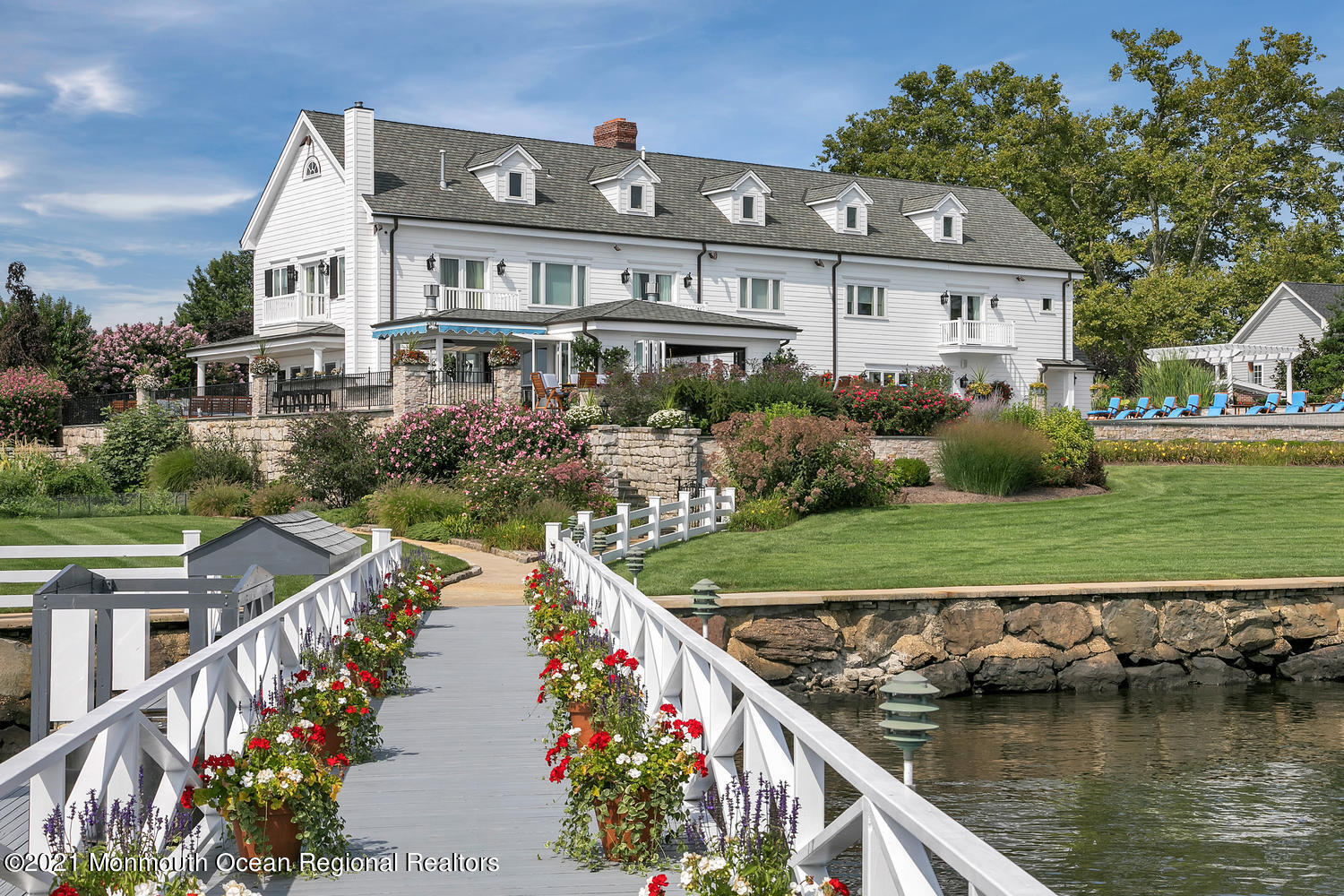 214 Conover Lane Red Bank, NJ 07701 - Photo 2 of 43 an aerial view of a house with a garden and lake view