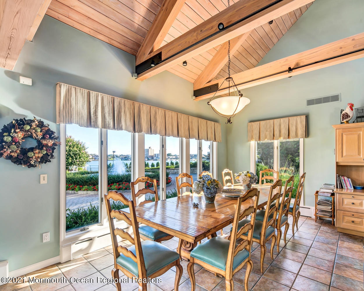 214 Conover Lane Red Bank, NJ 07701 - Photo 16 of 43 a dining room with furniture water view and a chandelier