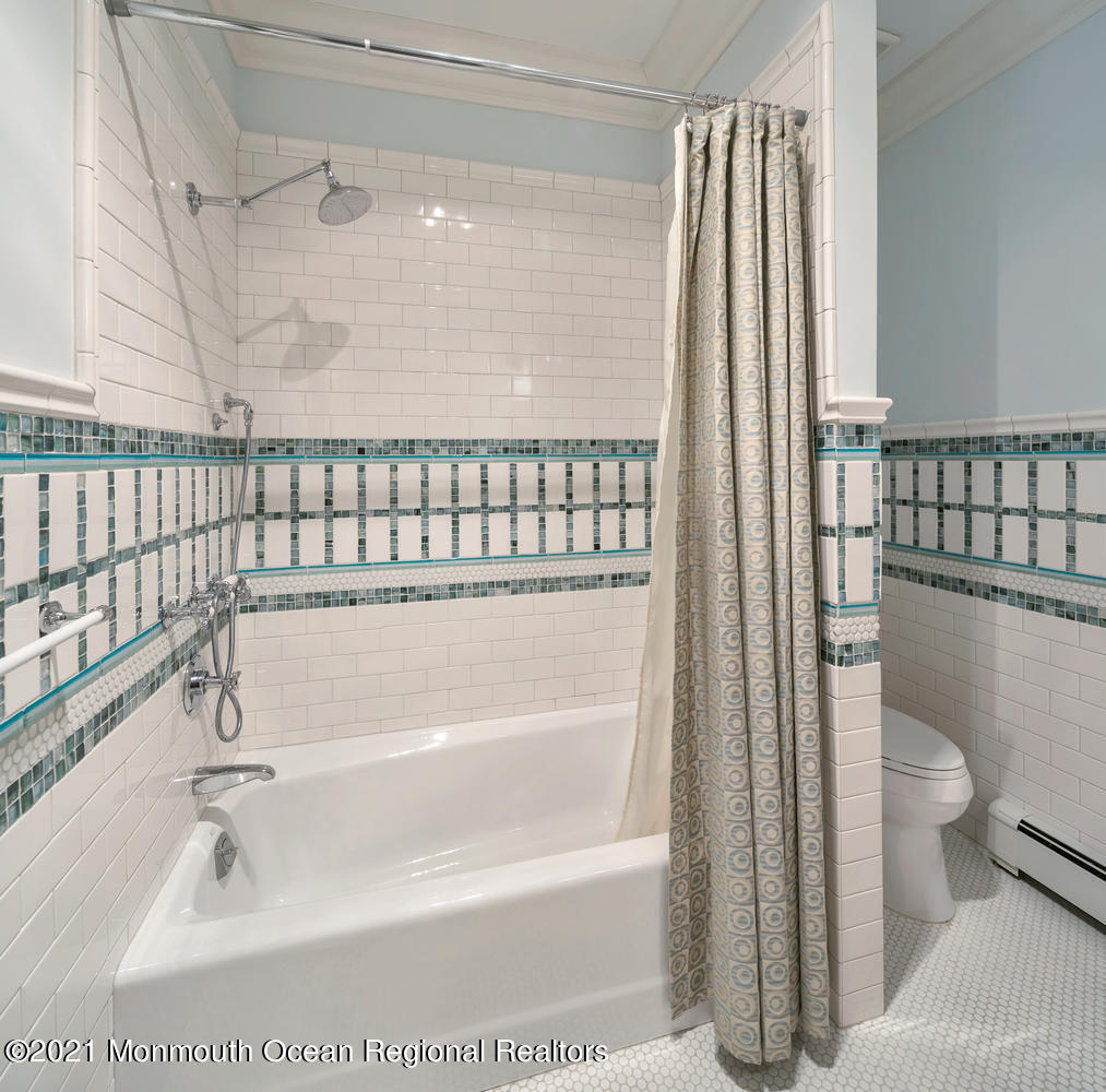 214 Conover Lane Red Bank, NJ 07701 - Photo 22 of 43 a bathroom with a bathtub and a shower