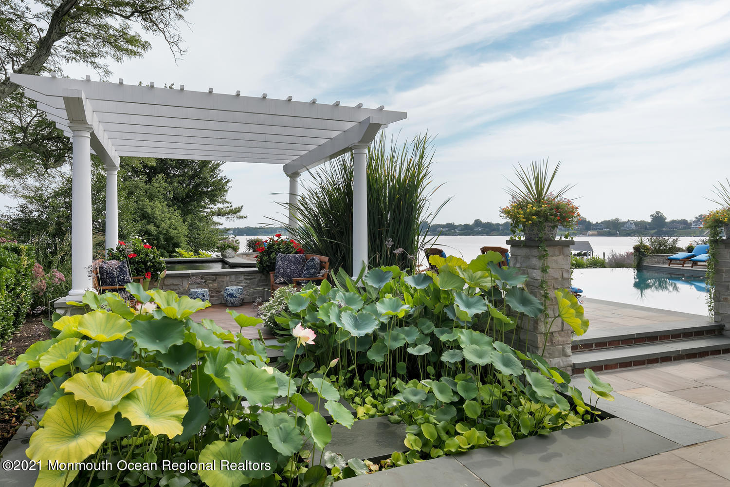 214 Conover Lane Red Bank, NJ 07701 - Photo 34 of 43 a view of a patio with table and chairs and potted plants