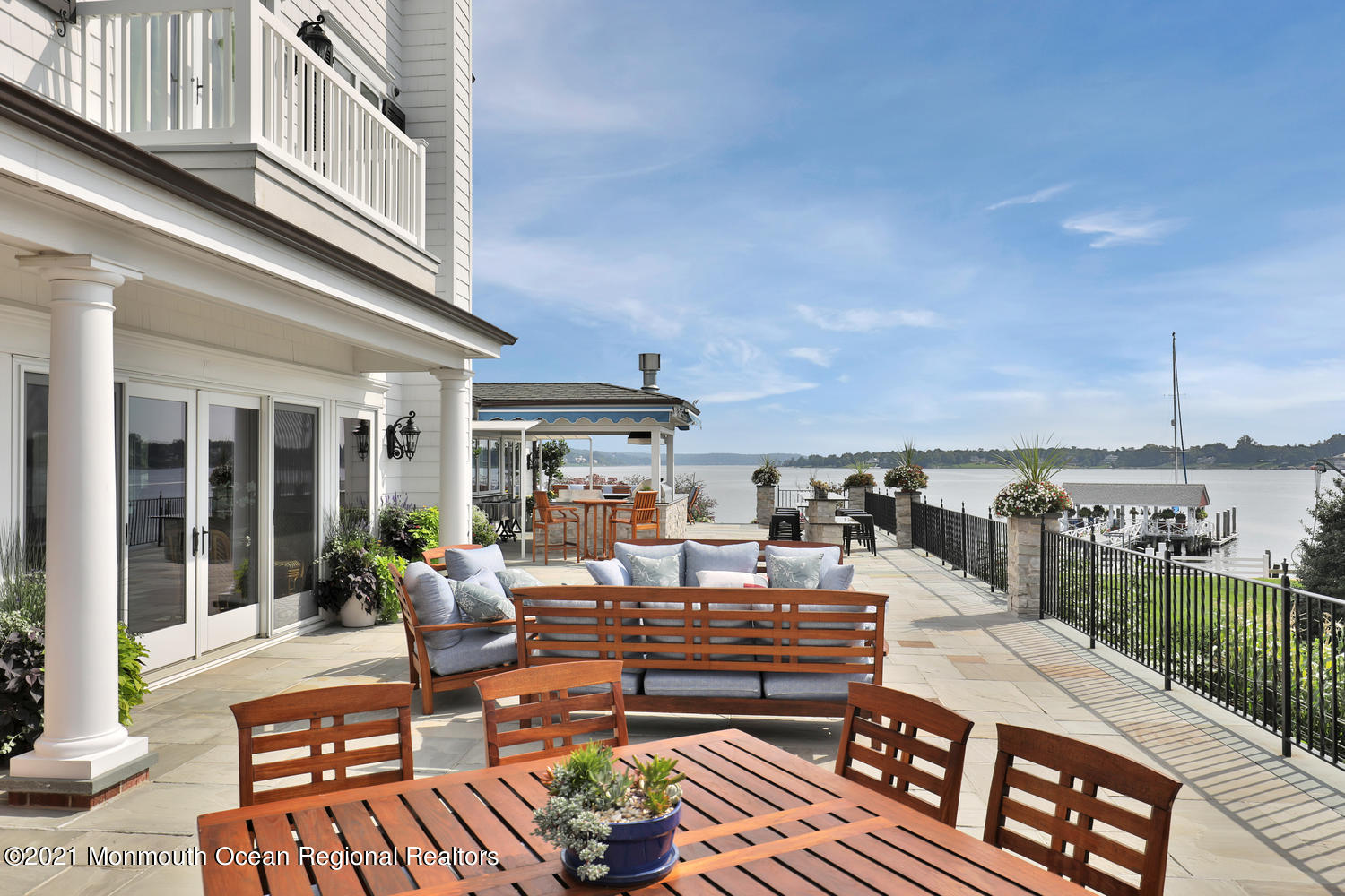 214 Conover Lane Red Bank, NJ 07701 - Photo 37 of 43 a outdoor space with patio the couches and a dining table with the ocean view