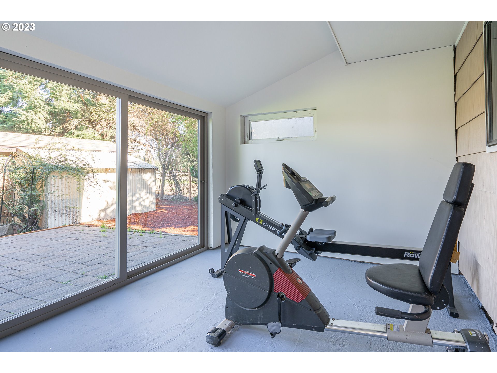 28171 Clear Lake Road Eugene, OR 97402 - Photo 33 of 48 a room with gym equipment and a large window
