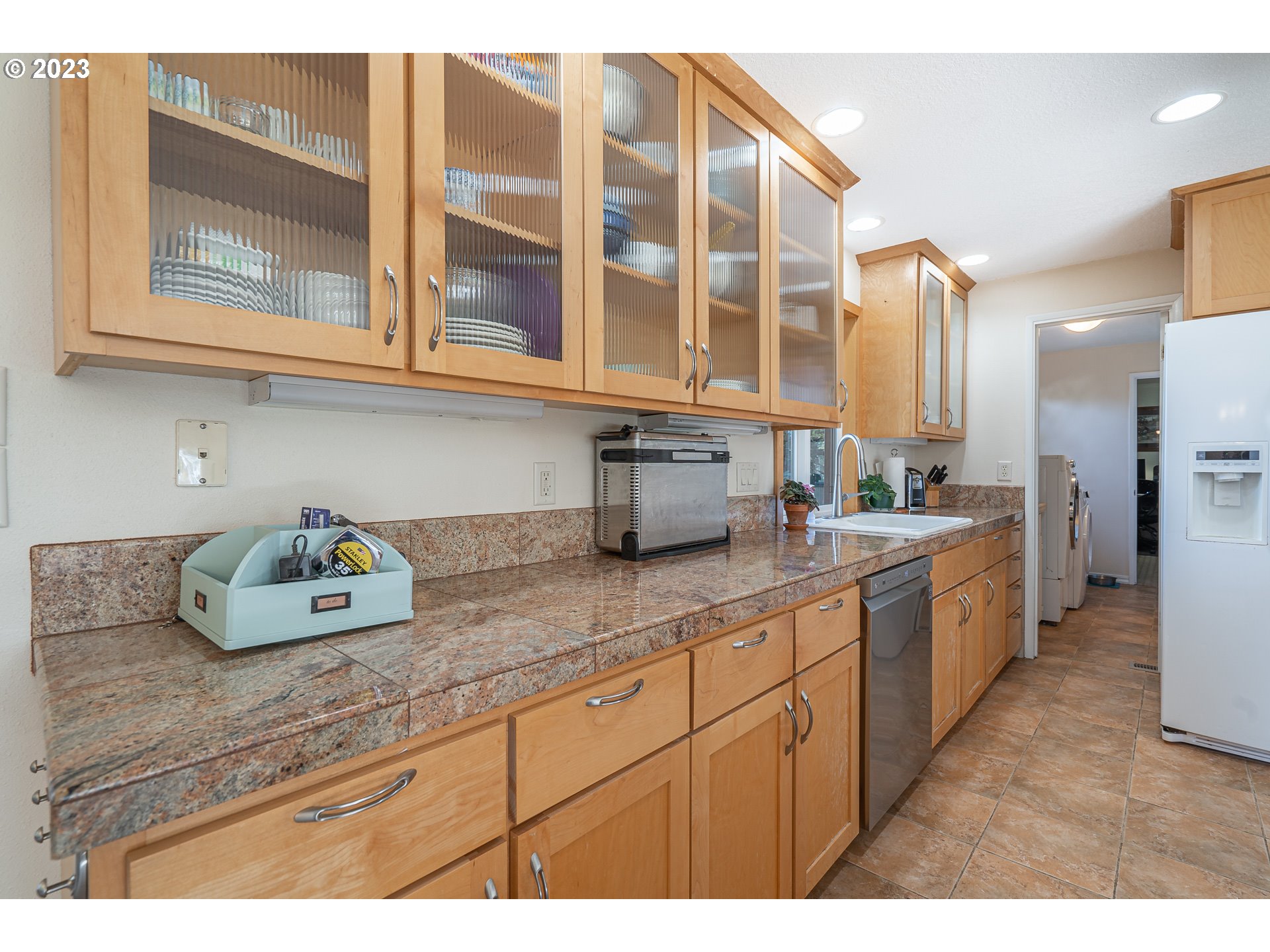 28171 Clear Lake Road Eugene, OR 97402 - Photo 4 of 48 a kitchen with stainless steel appliances granite countertop a sink a stove and cabinets