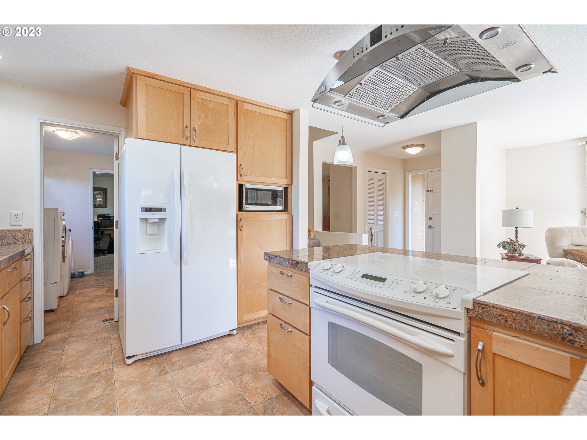 28171 Clear Lake Road Eugene, OR 97402 - Photo 5 of 48 a kitchen with a refrigerator and a sink