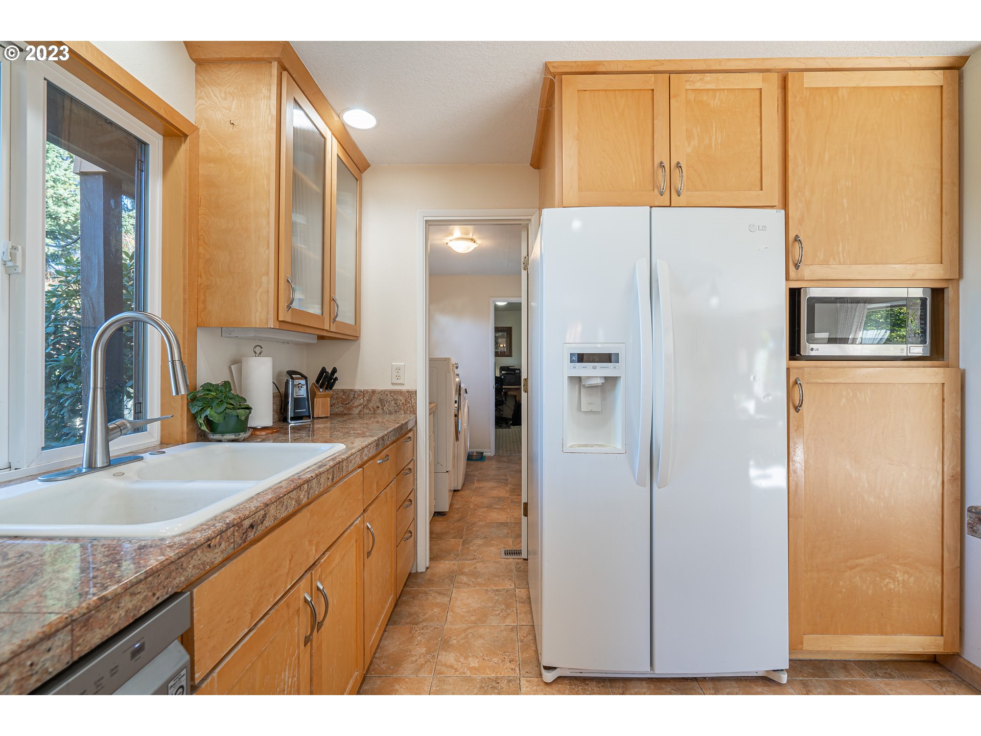 28171 Clear Lake Road Eugene, OR 97402 - Photo 7 of 48 a kitchen with a refrigerator and a sink