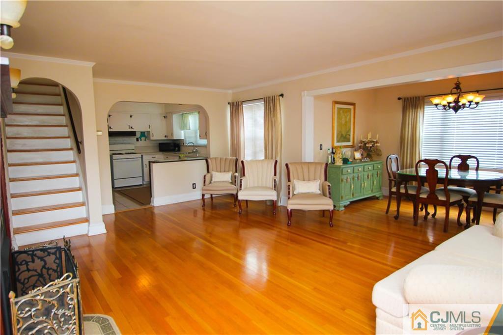 503 Crows Mill Road Fords, NJ 08863 - Photo 2 of 19 a living room with fireplace furniture and a table