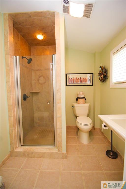 503 Crows Mill Road Fords, NJ 08863 - Photo 13 of 19 a bathroom with a toilet and a shower