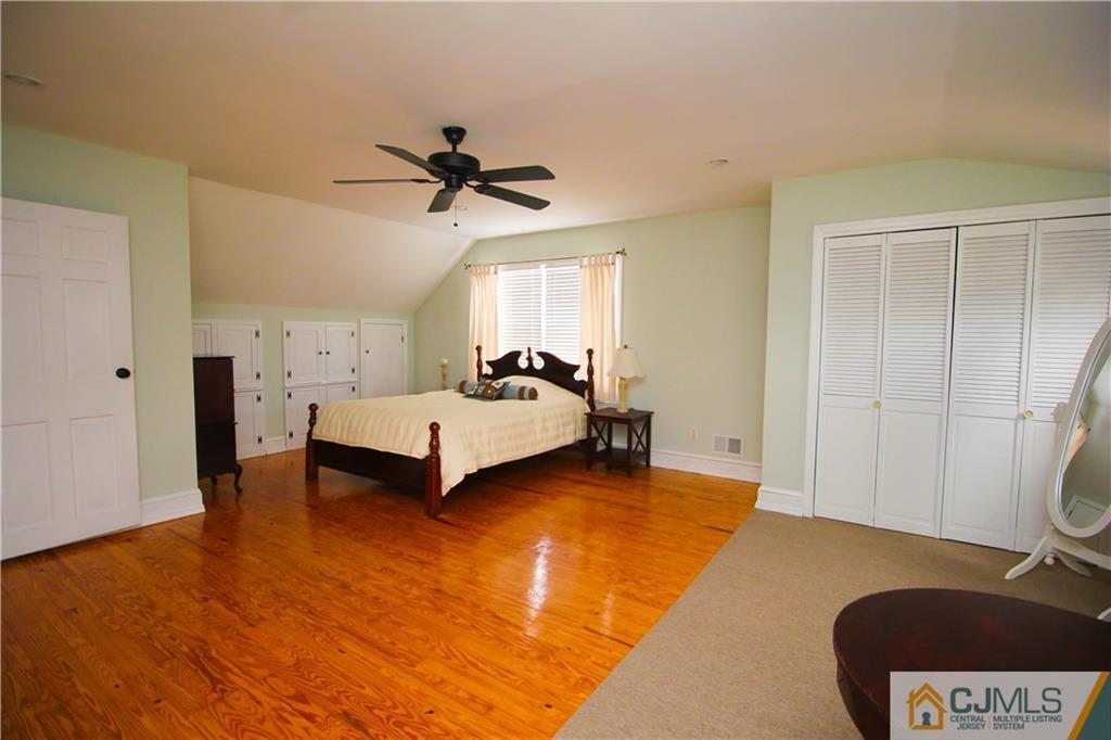 503 Crows Mill Road Fords, NJ 08863 - Photo 10 of 19 a spacious bedroom with a bed and a chair
