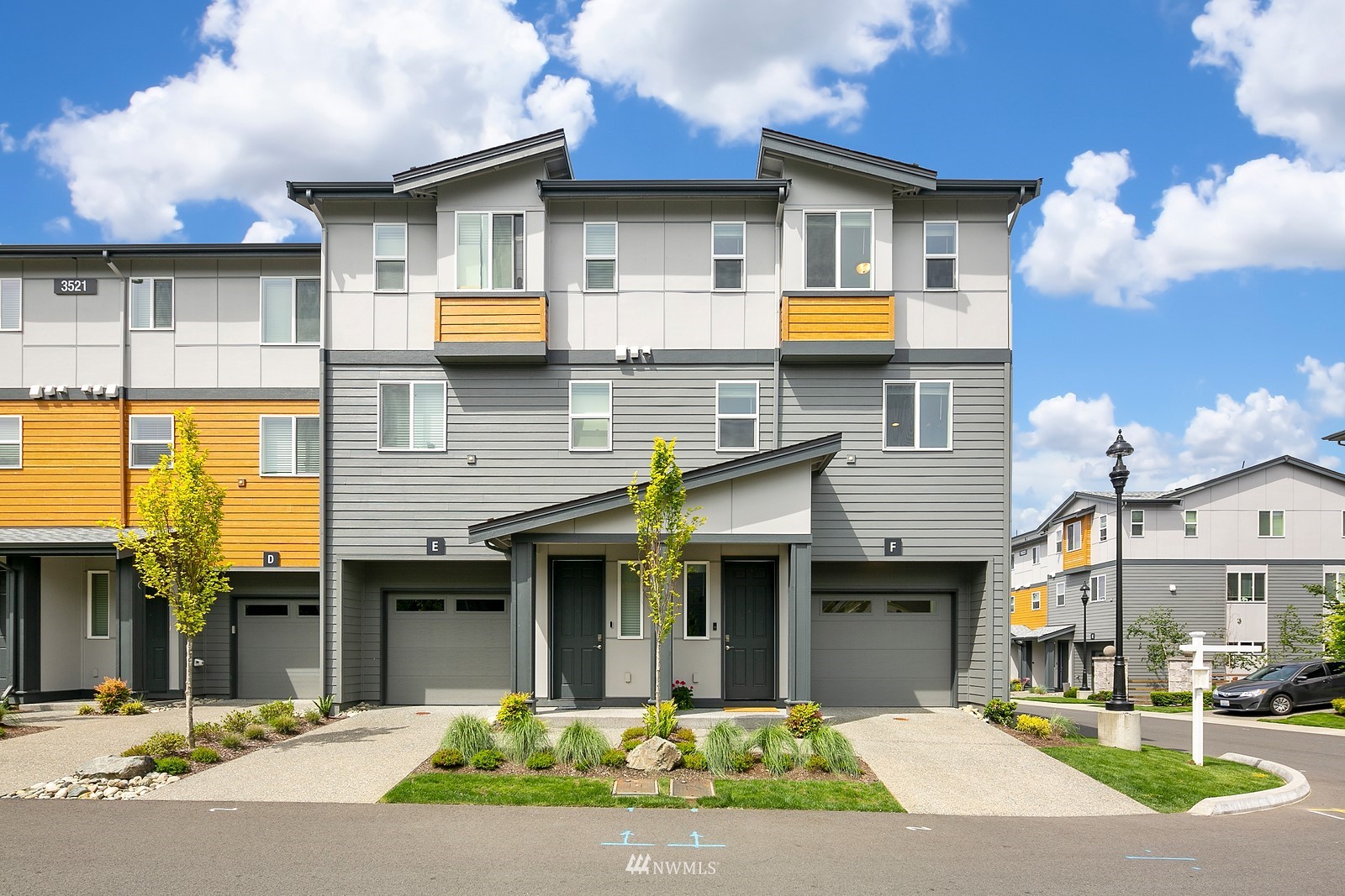 3521 193rd Street Southeast, Unit F Bothell, WA 98012 - Photo 1 of 29 a front view of a building with glass windows