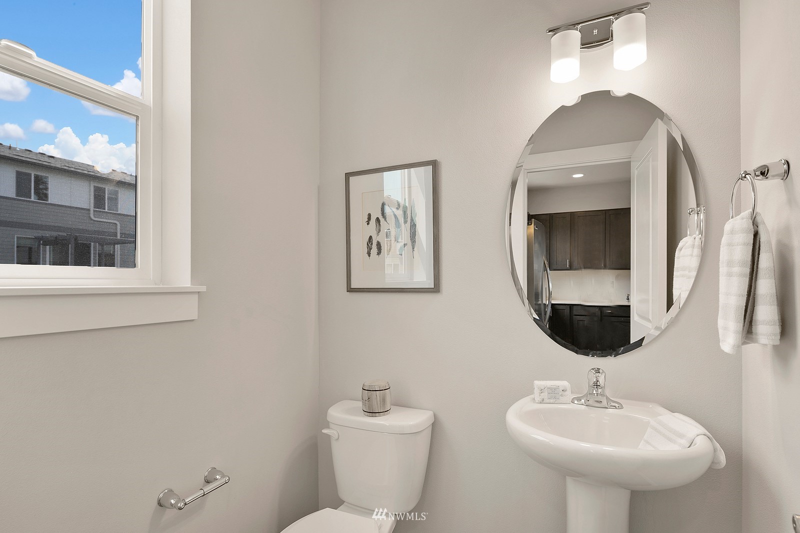 3521 193rd Street Southeast, Unit F Bothell, WA 98012 - Photo 12 of 29 a bathroom with a toilet sink and mirror