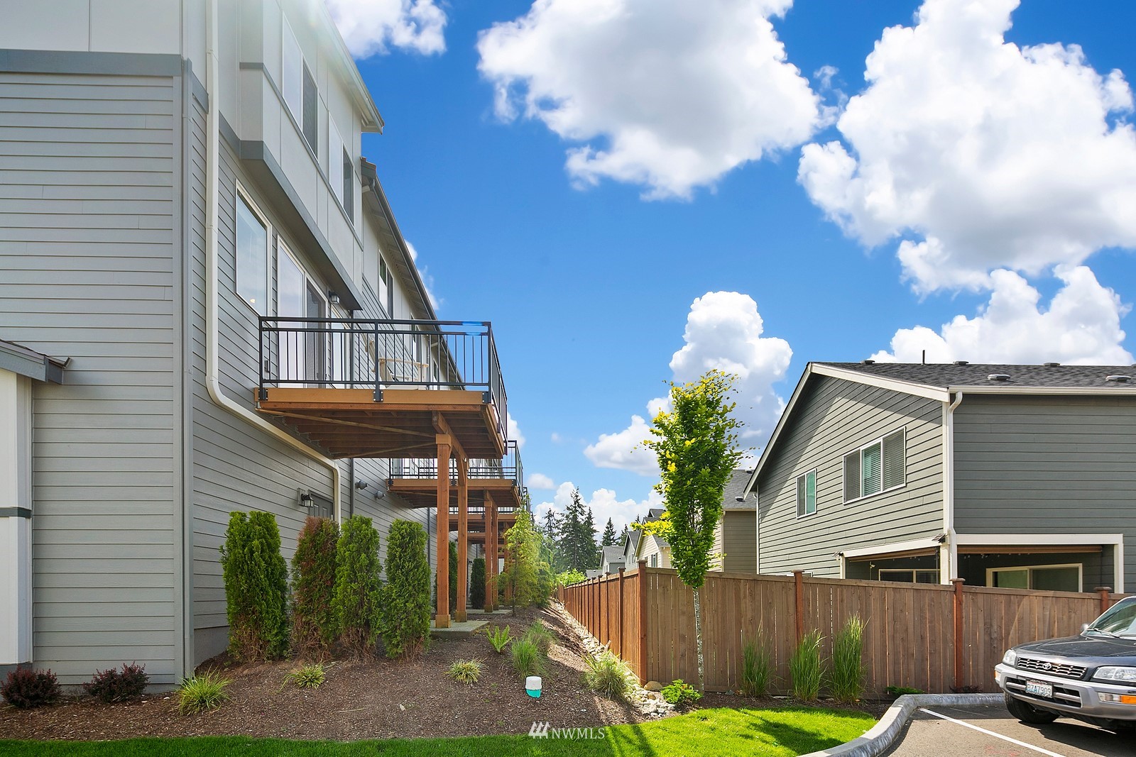 3521 193rd Street Southeast, Unit F Bothell, WA 98012 - Photo 26 of 29 a front view of a house with garden