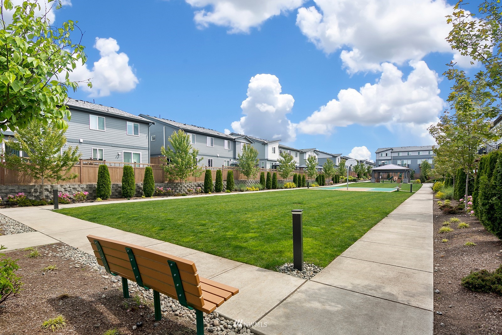 3521 193rd Street Southeast, Unit F Bothell, WA 98012 - Photo 27 of 29 a view of a house with a yard