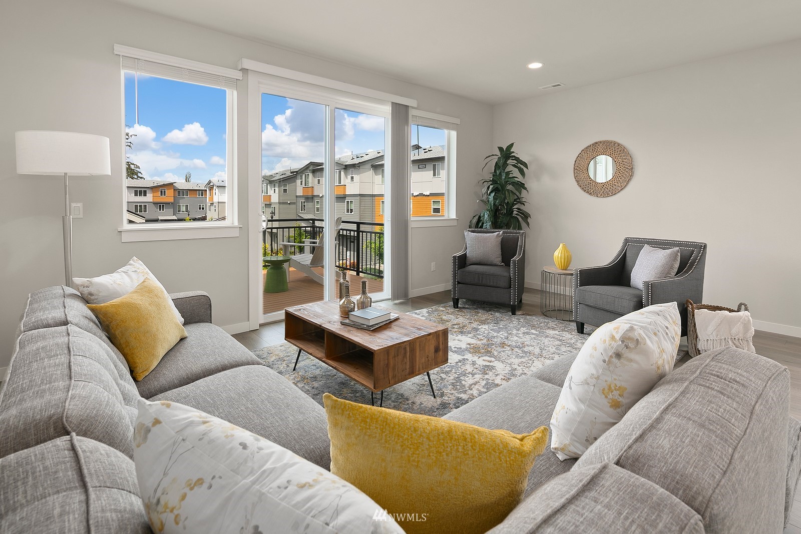 3521 193rd Street Southeast, Unit F Bothell, WA 98012 - Photo 6 of 29 a living room with furniture and a large window
