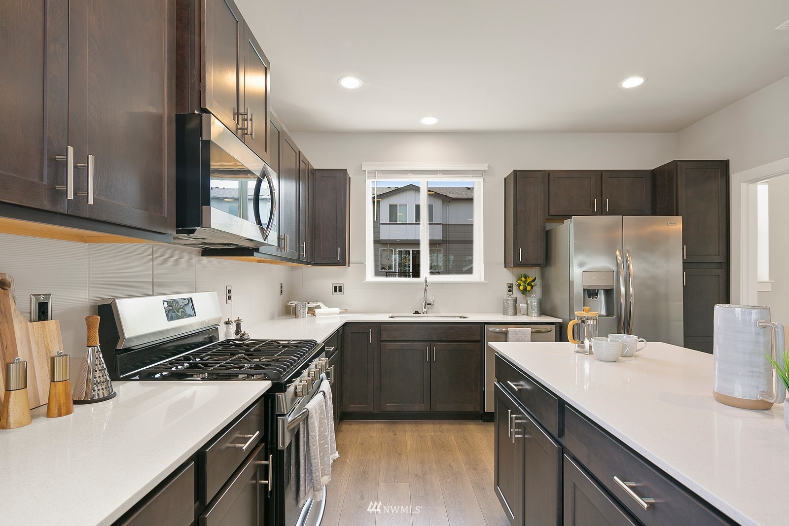3521 193rd Street Southeast, Unit F Bothell, WA 98012 - Photo 10 of 29 a kitchen with a sink stove and refrigerator