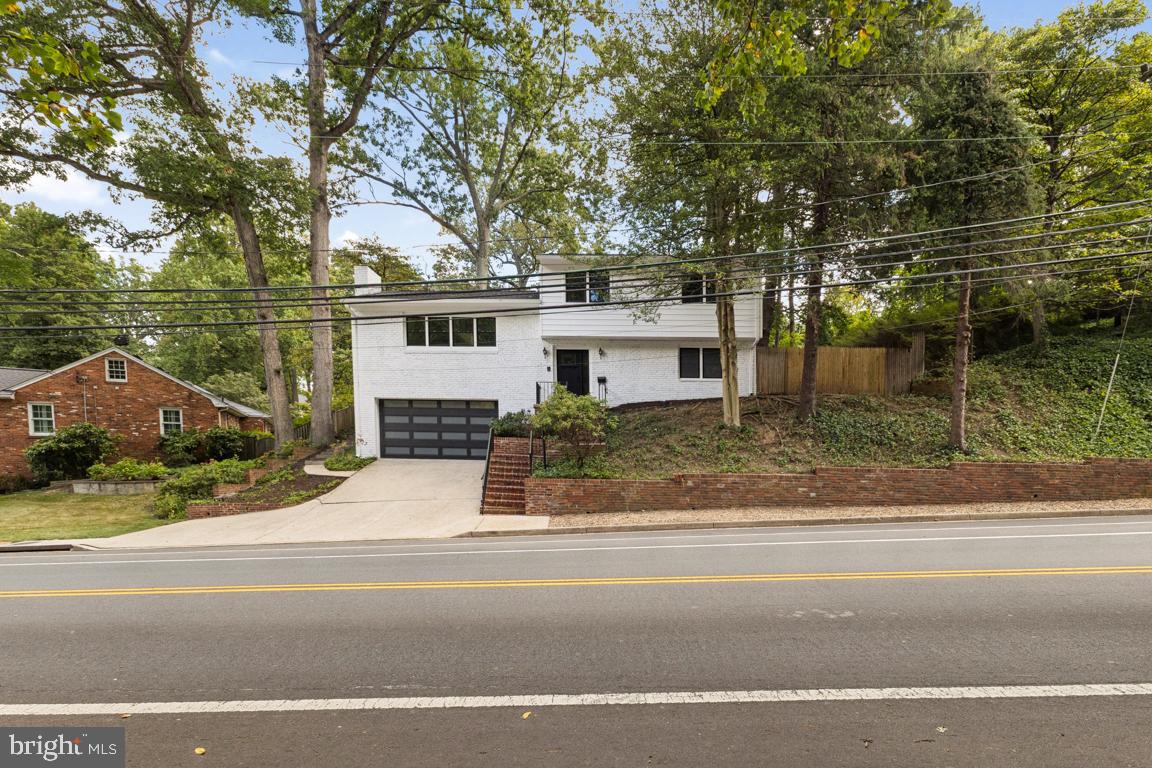 3209 Military Road Arlington, VA 22207 - Photo 1 of 45 front view of house with a tree in front of it