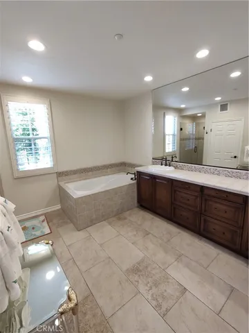 a bathroom with shower and window