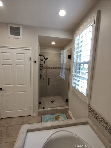 a view of an entryway with table and a workspace