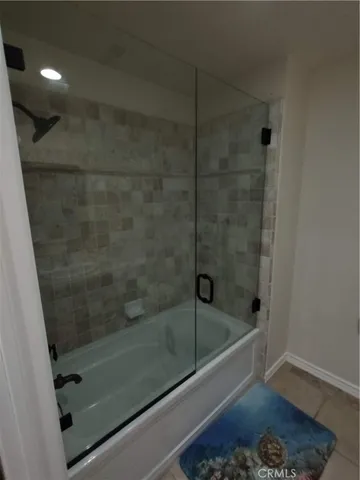 a view of a chair and fire pit in the backyard