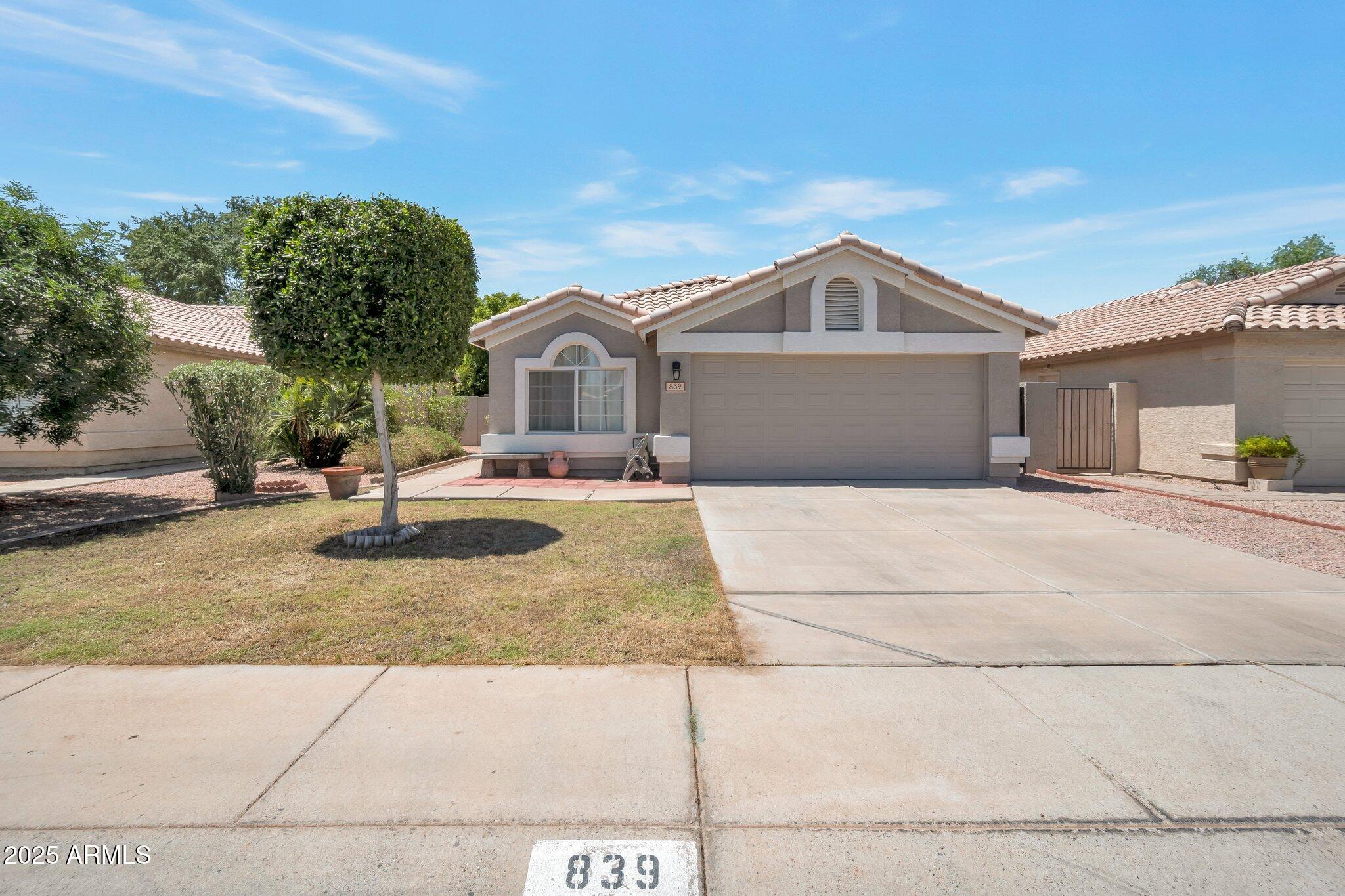 839 West Silver Creek Road Gilbert, AZ 85233 - Photo 12 of 15 a front view of a house with a yard