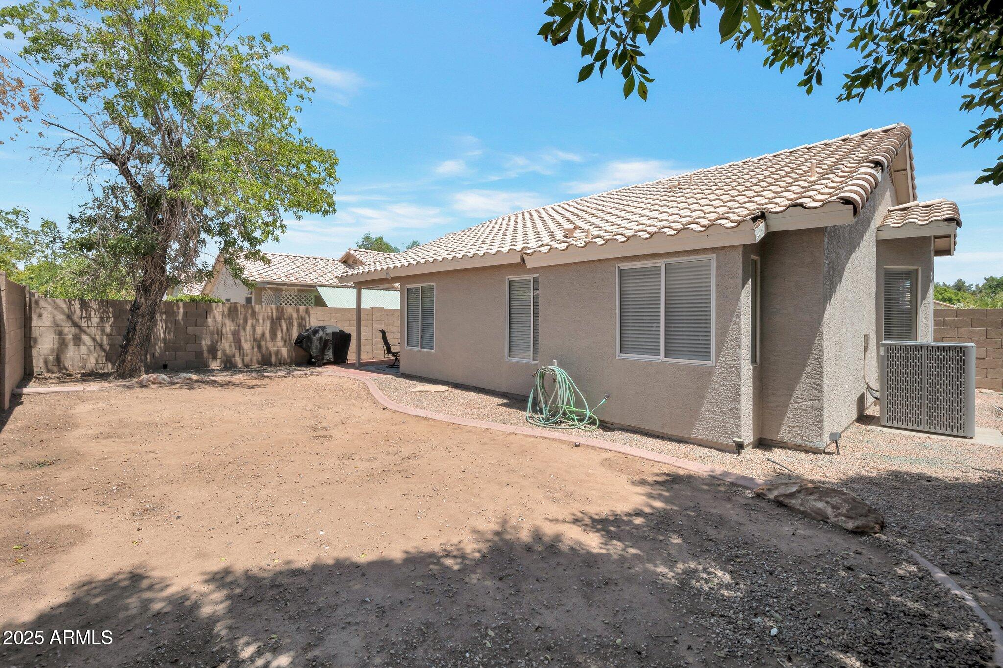 839 West Silver Creek Road Gilbert, AZ 85233 - Photo 15 of 15 a view of a house with a yard