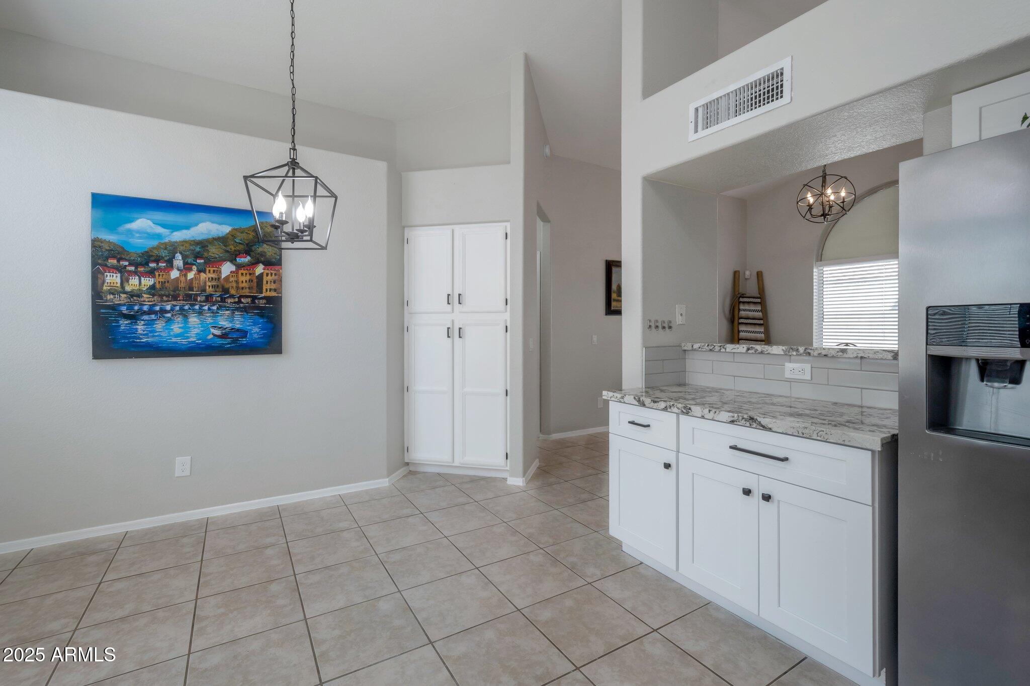 839 West Silver Creek Road Gilbert, AZ 85233 - Photo 3 of 15 a spacious bathroom with a granite countertop sink a mirror and a shower