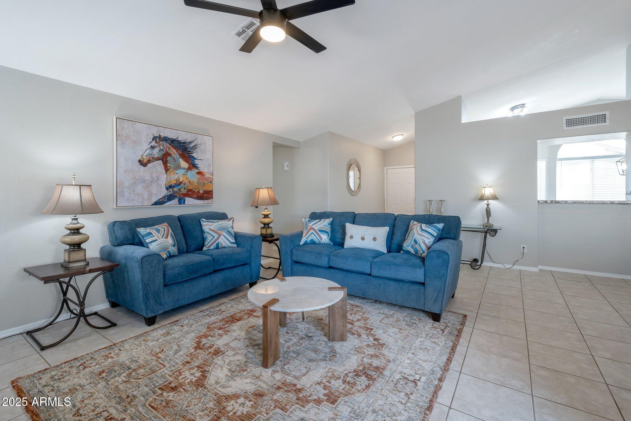 839 West Silver Creek Road Gilbert, AZ 85233 - Photo 5 of 15 a living room with furniture and a rug
